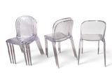 three clear plastic chairs sitting next to each other on a white surface