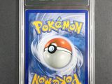 a close up of a pokemon card in a plastic case