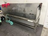 a large metal sink in the corner of a room