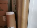 a stack of boxes and a bag sitting on the floor