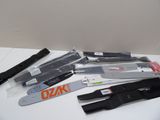 many different types of knives on a white table