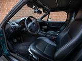 the interior of a car with black leather seats and a steering wheel