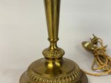 an image of a brass table lamp with a cord attached to it