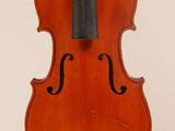 an old violin with a bow hanging from it ' s back