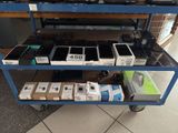 a blue cart with a lot of electronics on top of it