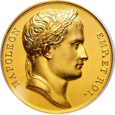 gold coin with a portrait of a man in profile on a white background