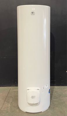 a white water heater sitting on top of a floor next to a black wall