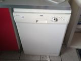 a white dishwasher sitting in a kitchen next to a counter