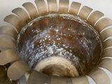 a silver bowl with a lid and a spoon in it