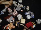 a lot of small figurines on a black table