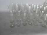 a lot of empty wine glasses sitting on a table