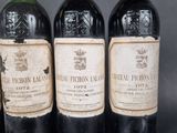 three bottles of wine sitting next to each other on a table