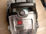 a vacuum that is sitting on a wooden table