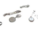 many different types of jewelry on a white surface