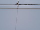 a close up of a white van with a crack in the side of it
