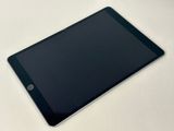 a close up of a tablet computer sitting on top of a table