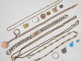 several different types of jewelry are displayed on a white surface