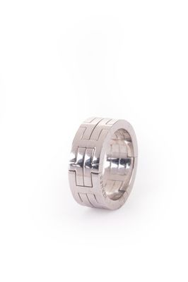 a close up of a silver ring on a white background