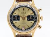 a close up of a wrist watch with a brown leather strap