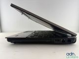 a black laptop sitting on a table with its lid open