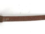a knife that is laying on a white surface