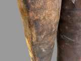 pair of brown leather boots on a gray background