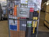 a metal cart with many boxes on it in a warehouse