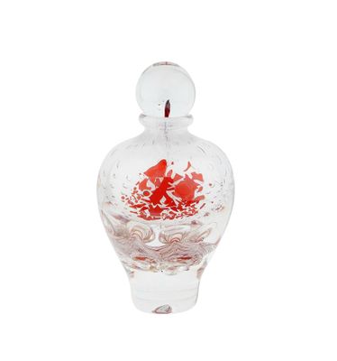 a glass vase with a red flower inside of it