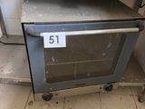 two ovens that are sitting on a counter