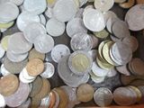 a box full of coins sitting on top of a table