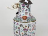 an image of a vase with a bird sitting on top of it