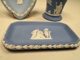 two vases and a tray with a picture of a nativity