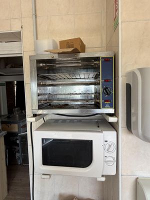 a white microwave oven sitting on top of a counter