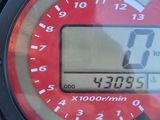 a close up of a digital clock on the side of a building