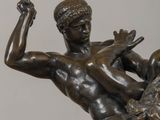 bronze statue of a man on a horse with a woman on his back