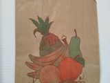 a brown paper bag with a picture of a bunch of fruit on it
