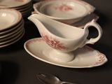 a lot of plates and saucers on the table