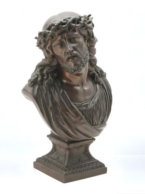bronze bust of a man with a crown of thorns on his head