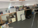 a room with a lot of clutter and boxes on the floor