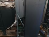 two refrigerators sitting on a pallet in a warehouse
