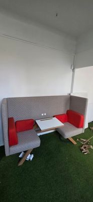 a couch and a table in the corner of a room