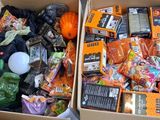 two boxes filled with halloween candy and candy bags