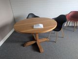 two chairs and a table in the corner of a room