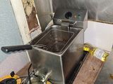 a deep fryer that is sitting on a counter