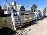 a white ladder that is next to a building