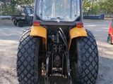 a tractor that is parked in a parking lot