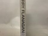 the book is sitting on a white surface with a white background