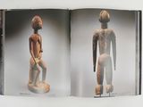 an open book with a picture of a man and a woman standing next to each other