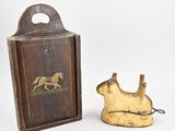 an old wooden box with a painting of a horse and a dog on it