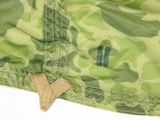 a close up of a camouflage jacket with a patch on it